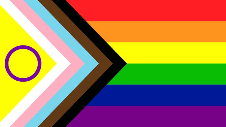 2SLGBTQIA Photo The Progress Pride Flag with inclusive colors representing LGBTQ+ communities.